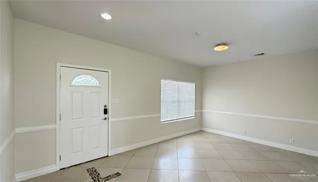 a view of an empty room and window