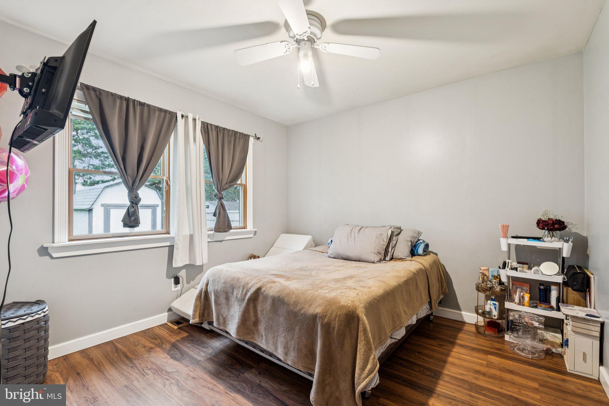 805 North York Road Sterling, VA 20164 - Photo 12 of 17 a bedroom with a bed and wooden floor