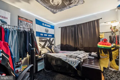 a bedroom that has a bed and a closet
