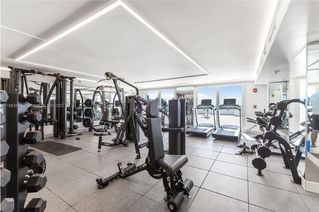 a view of swimming pool with outdoor seating and city view