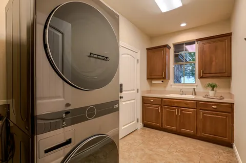 a spacious bathroom with a double vanity sink and a mirror