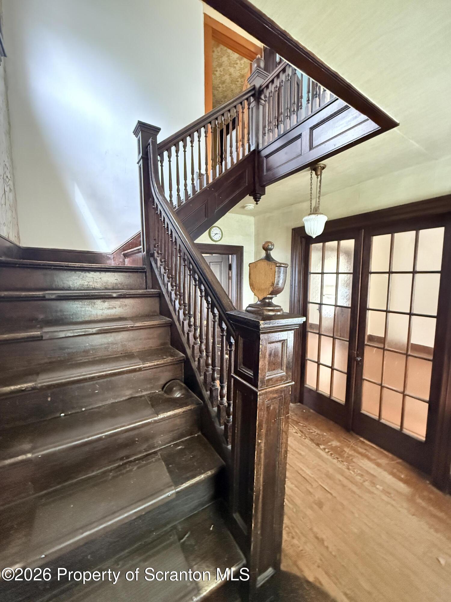 2045 Edna Avenue Scranton, PA 18508 - Photo 13 of 44 a view of staircase with lots of frames on wall and a window
