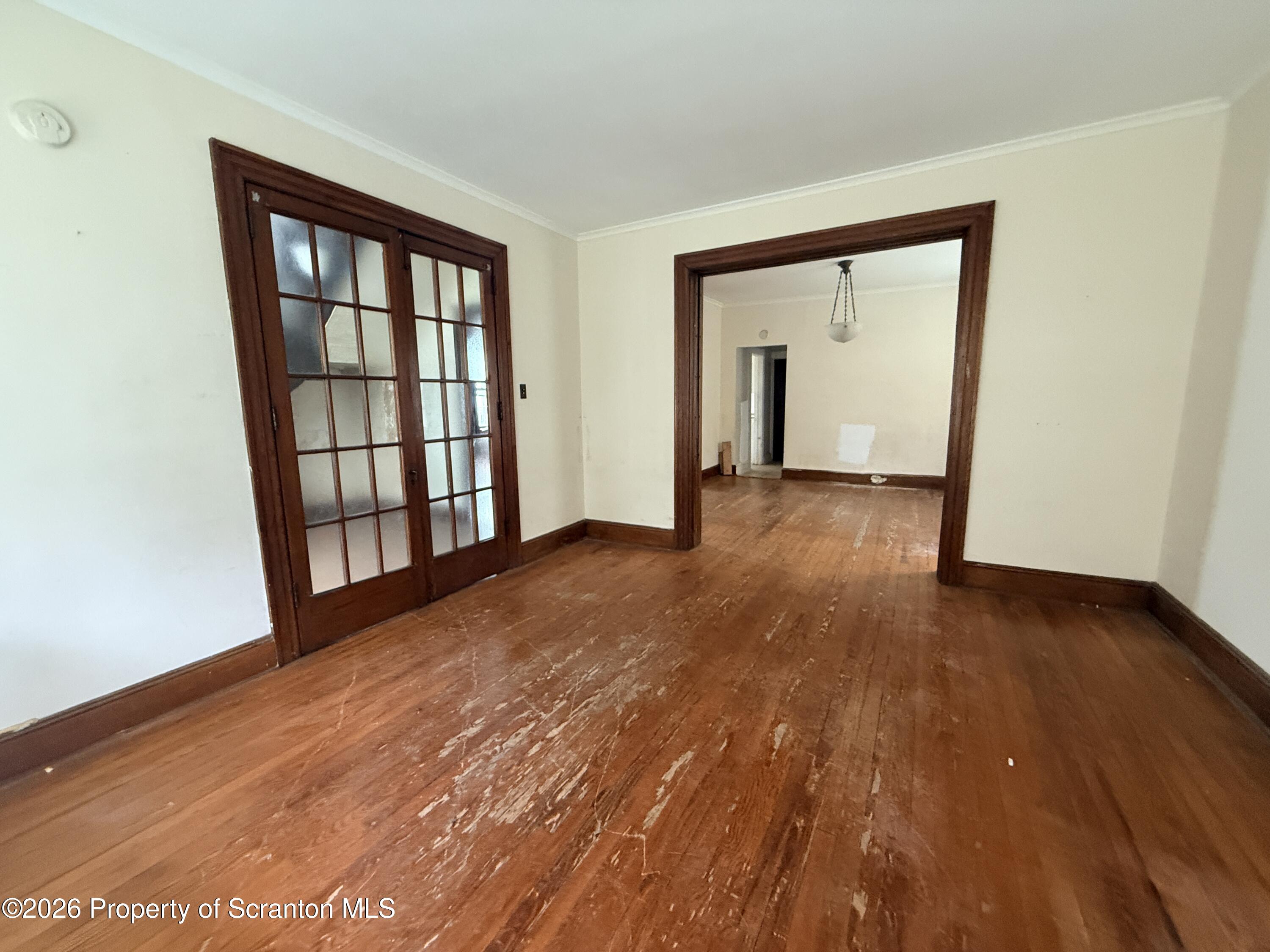 2045 Edna Avenue Scranton, PA 18508 - Photo 15 of 44 a view of an empty room with wooden floor and a window