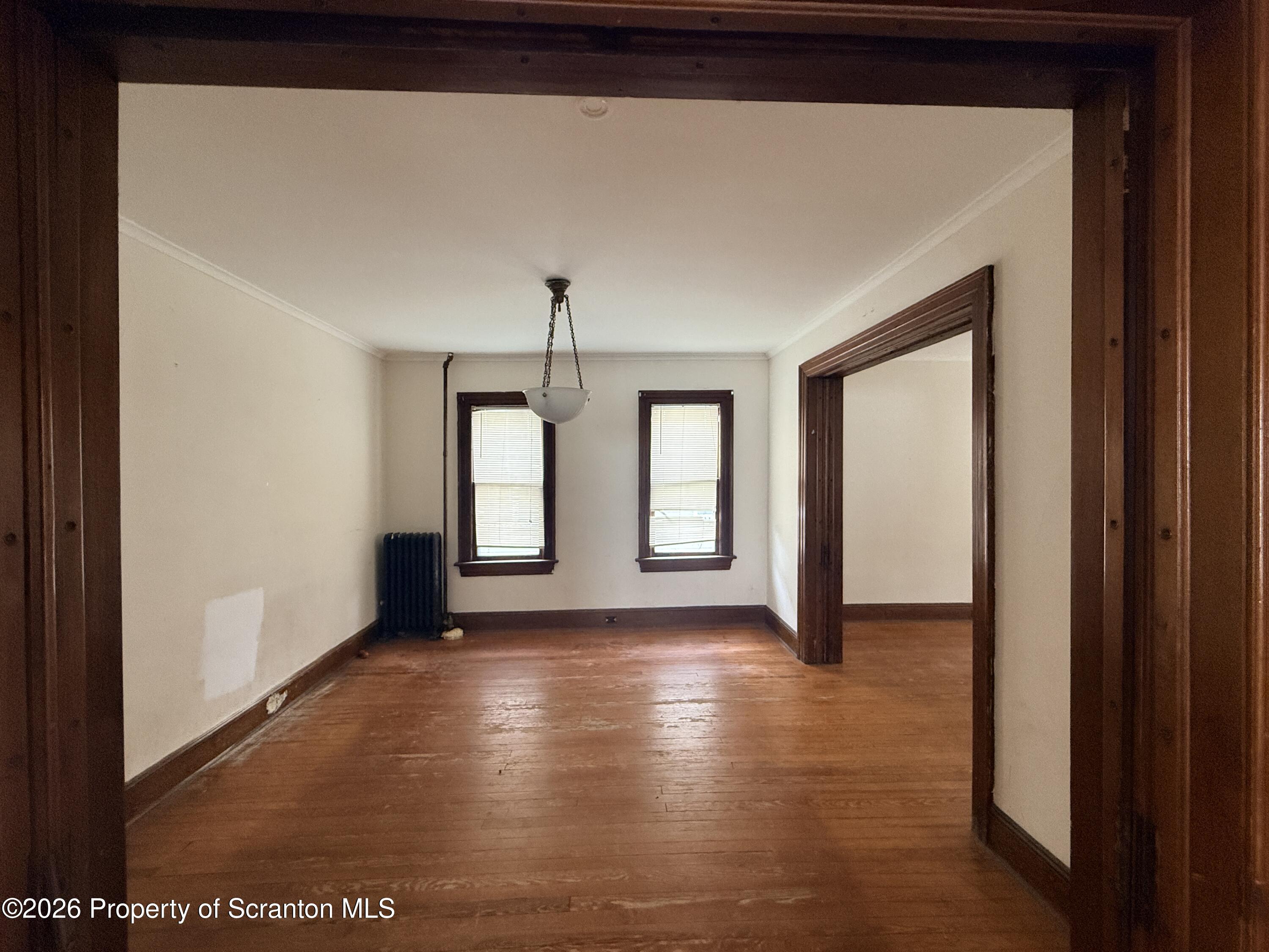 2045 Edna Avenue Scranton, PA 18508 - Photo 16 of 44 a view of an empty room with window and wooden floor