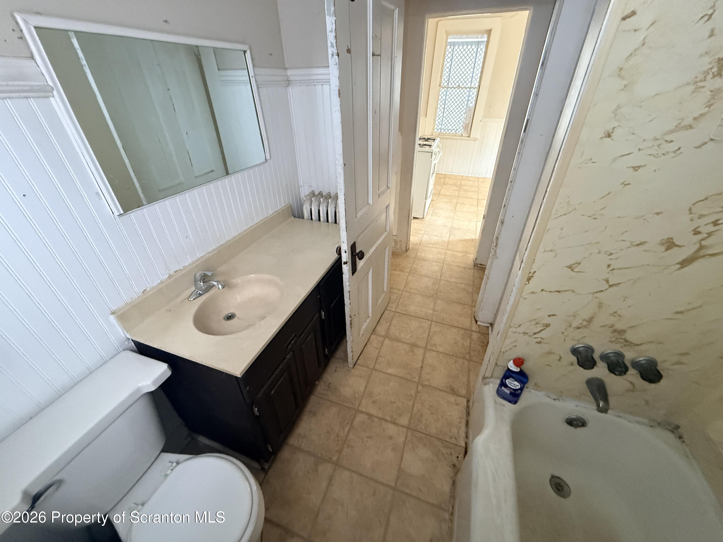 2045 Edna Avenue Scranton, PA 18508 - Photo 17 of 44 a bathroom with a sink toilet and shower