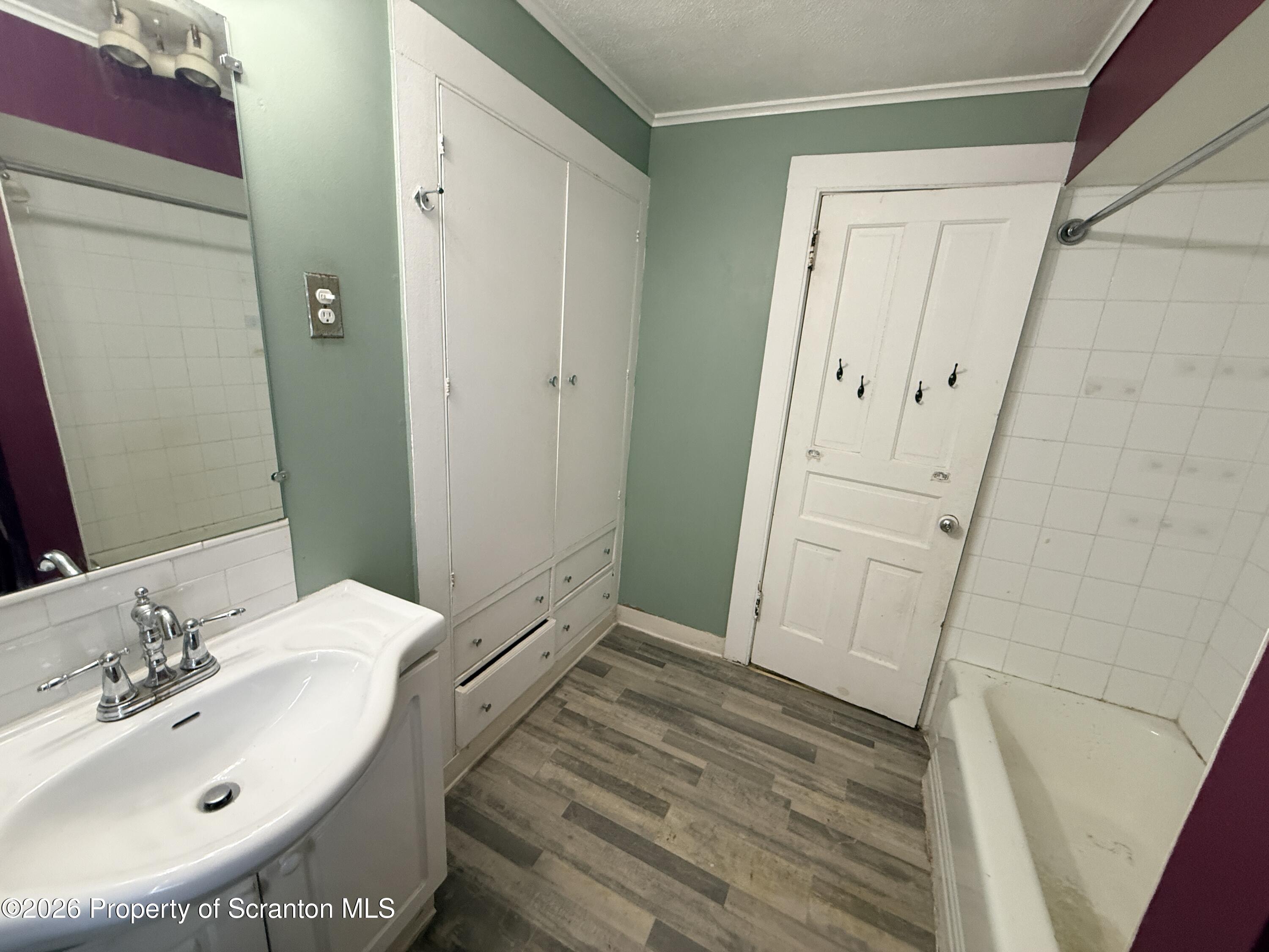 2045 Edna Avenue Scranton, PA 18508 - Photo 28 of 44 a bathroom with a sink and a mirror