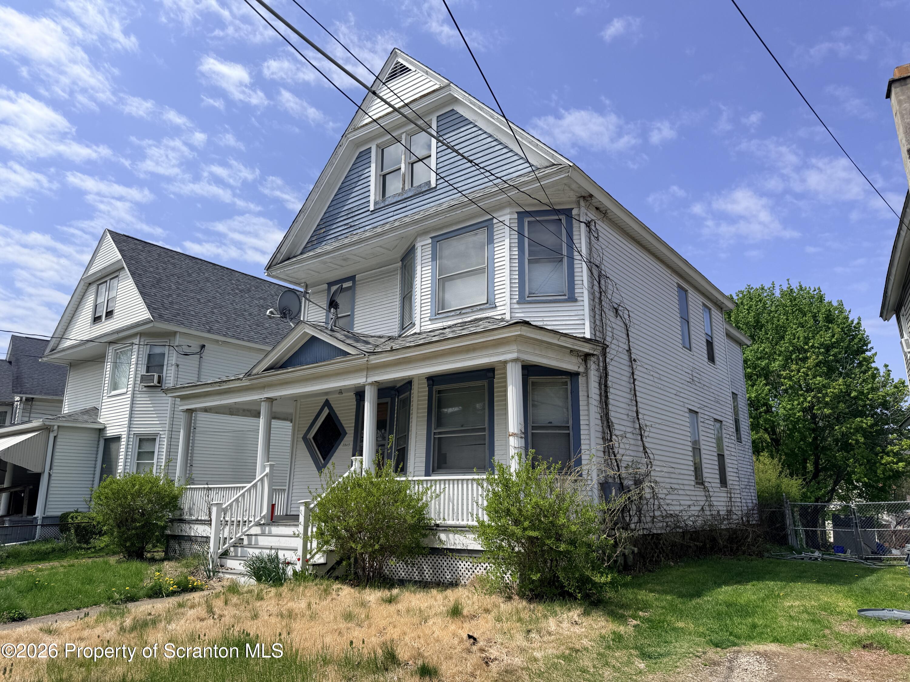 2045 Edna Avenue Scranton, PA 18508 - Photo 3 of 44 a front view of a house with garden