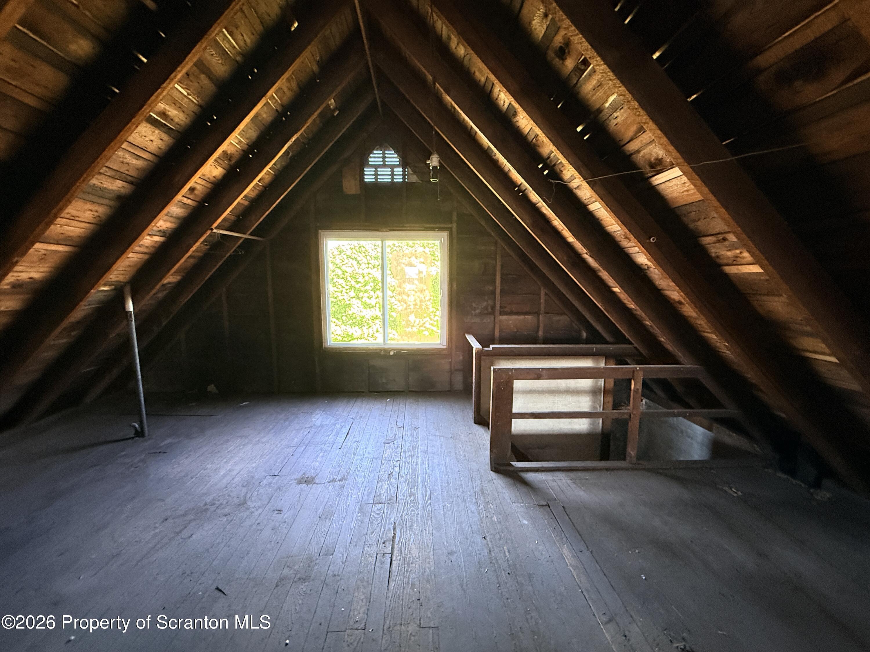 2045 Edna Avenue Scranton, PA 18508 - Photo 36 of 44 an empty room with wooden floor staircase and windows
