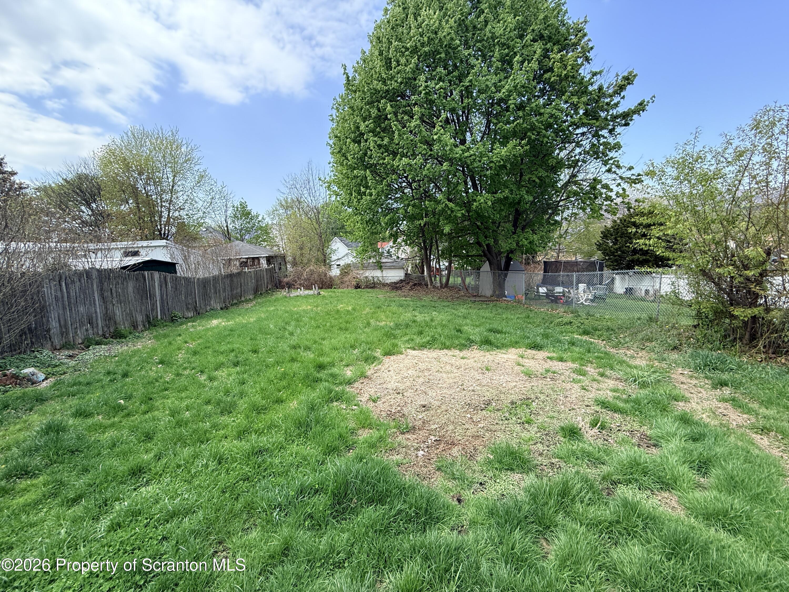 2045 Edna Avenue Scranton, PA 18508 - Photo 37 of 44 a view of a backyard with a garden and trees