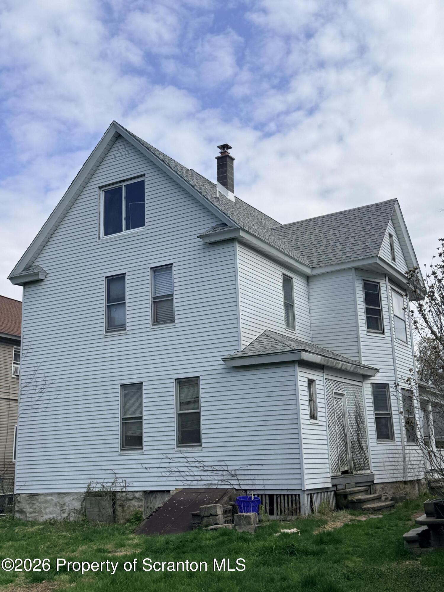 2045 Edna Avenue Scranton, PA 18508 - Photo 41 of 44 a front view of a house with a yard
