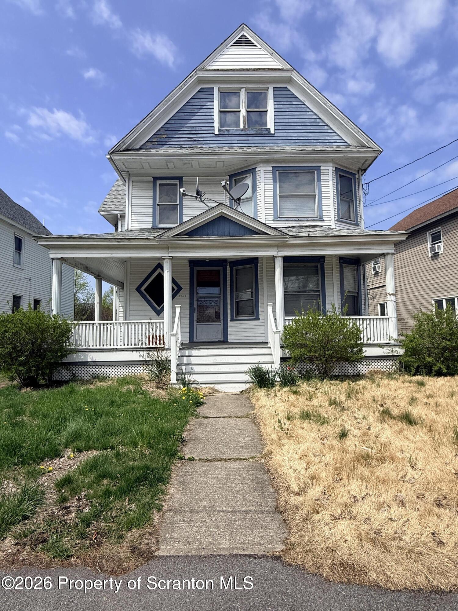 2045 Edna Avenue Scranton, PA 18508 - Photo 5 of 44 a front view of a house with a yard