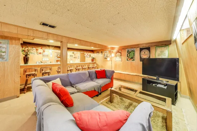 a view of a house with a table and chairs