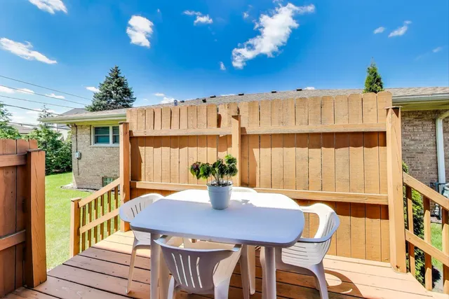 a view of a patio with couches chairs and a potted plant
