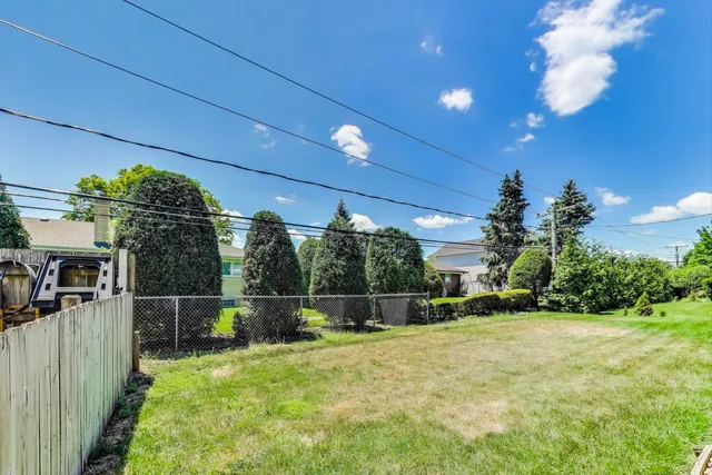 a picture of a bench in front of a wall
