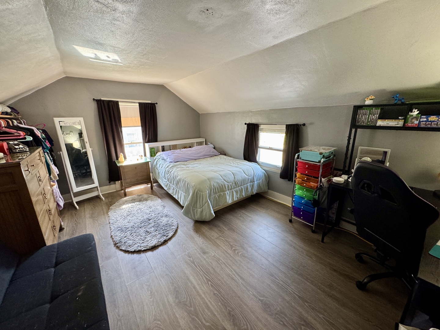 304 South Church Street Sheffield, IL 61361 - Photo 17 of 23 a bedroom with furniture and a wooden floor