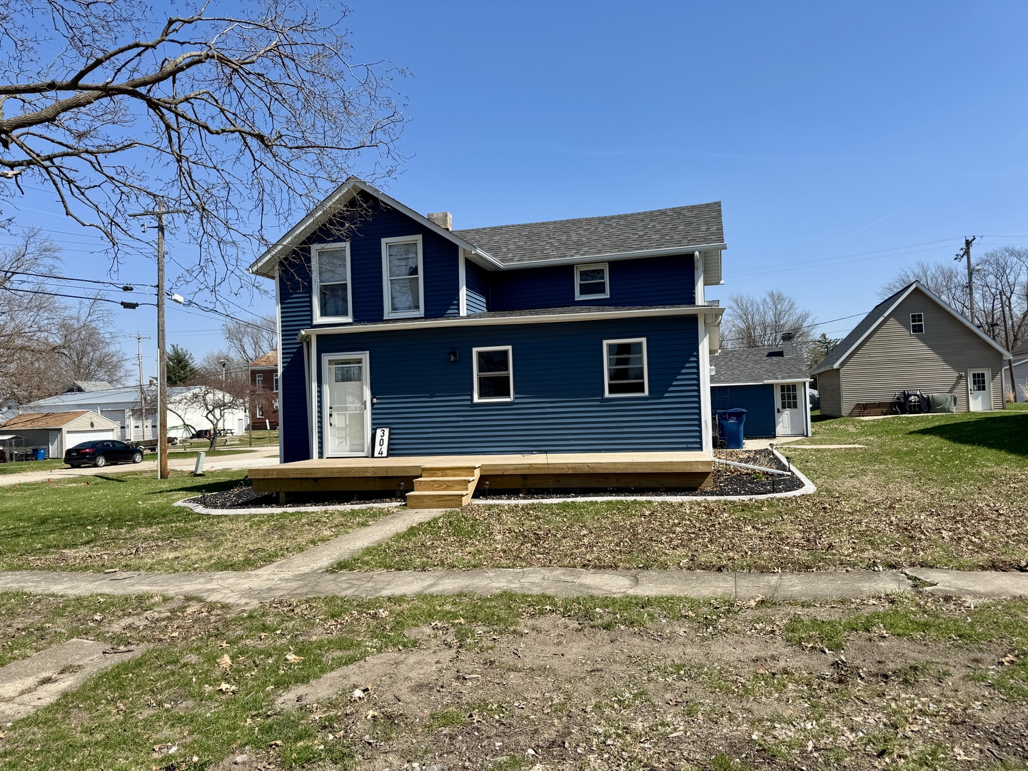 304 South Church Street Sheffield, IL 61361 - Photo 2 of 23 a front view of a house with a yard