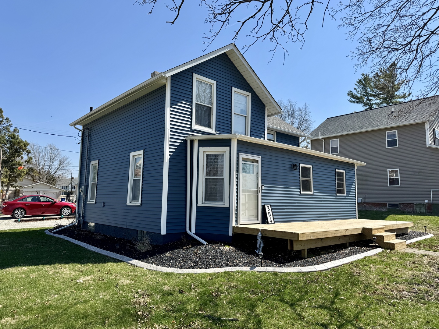 304 South Church Street Sheffield, IL 61361 - Photo 3 of 23 a front view of a house with a yard