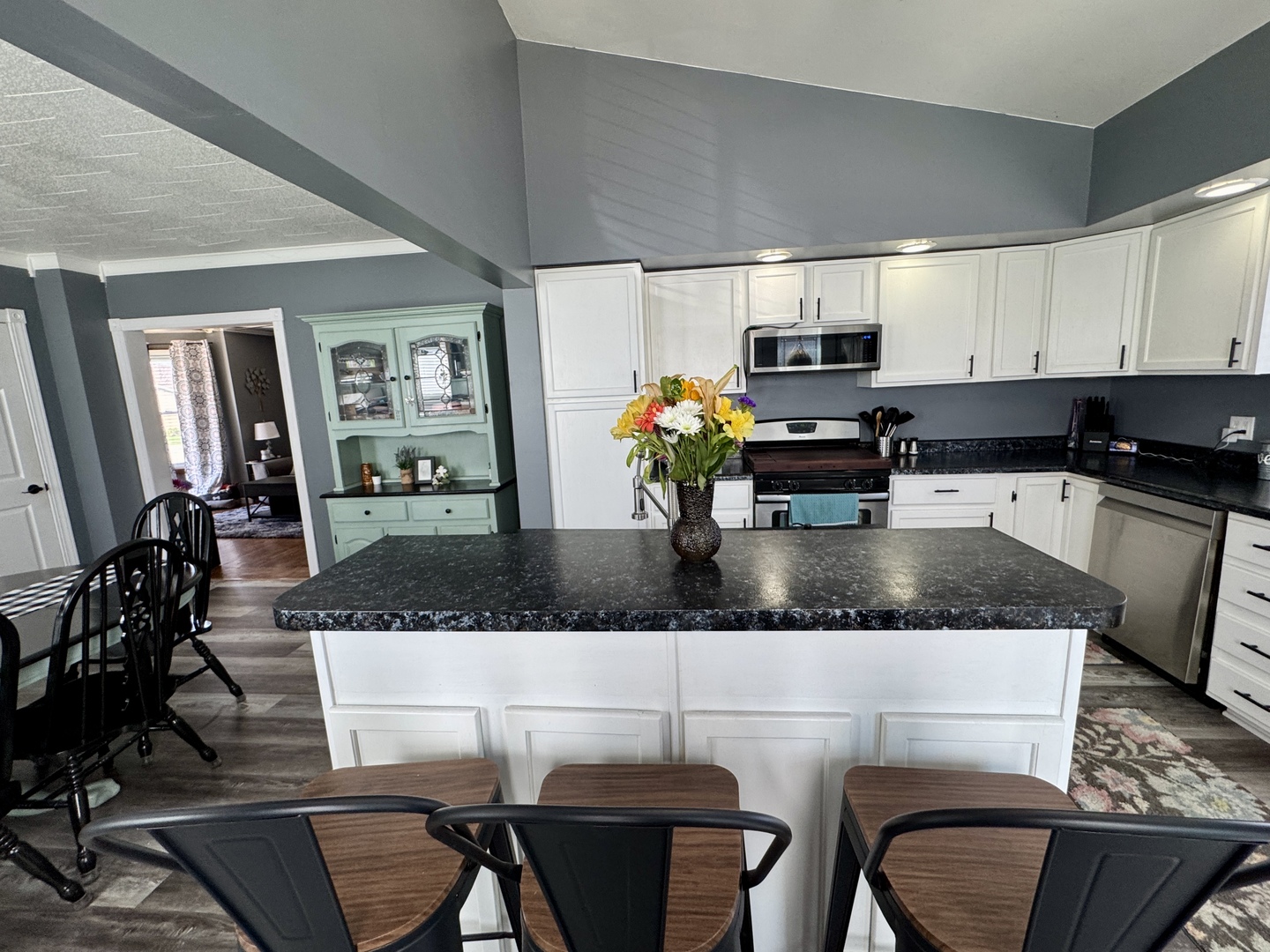 304 South Church Street Sheffield, IL 61361 - Photo 8 of 23 a kitchen with a table chairs stove and cabinets