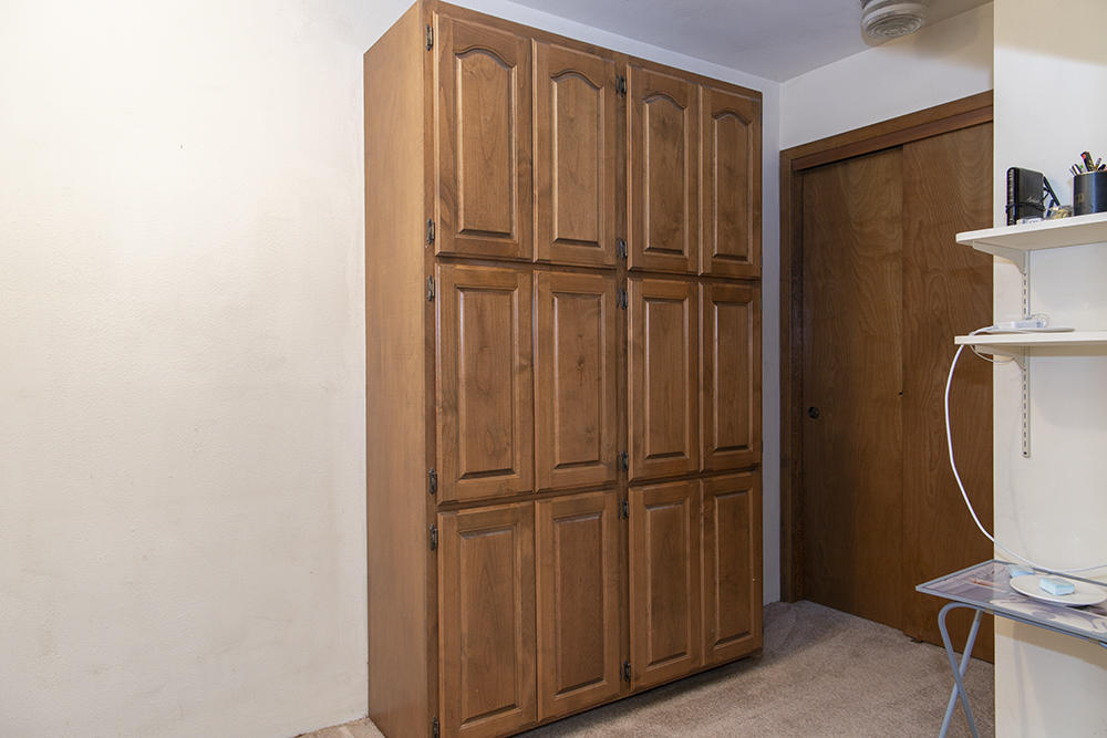 1735 Robertson Bridge Road Grants Pass, OR 97526 - Photo 15 of 47 a view of a closet area with wooden floor