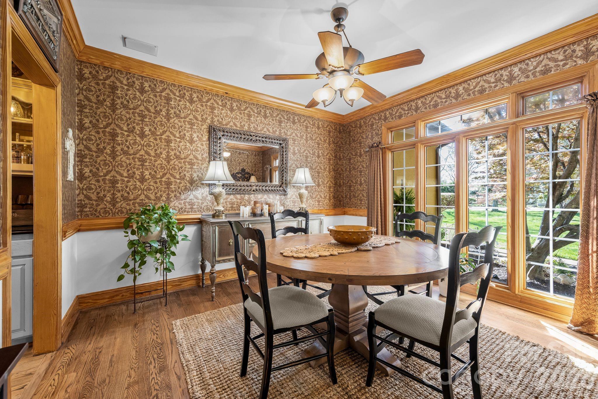 3530 Cardiff Lane Matthews, NC 28104 - Photo 7 of 39 a view of a dining room with furniture window and wooden floor