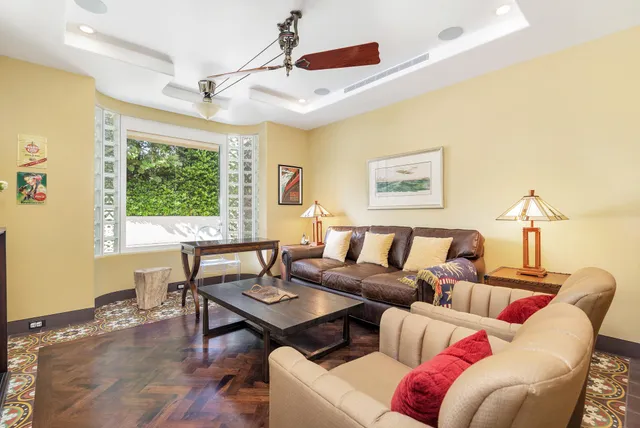 a living room with furniture and a window