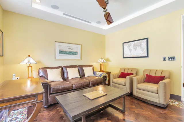 a living room with furniture and a rug