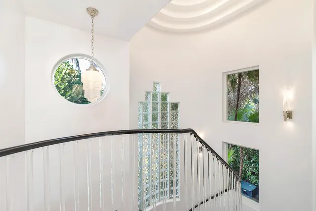a view of a hallway with windows