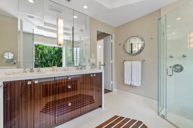 a bathroom with a sink a mirror and window