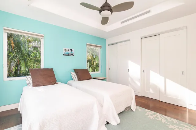 a bedroom with double bed and a window