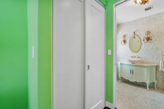 a bathroom with a mirror and a sink