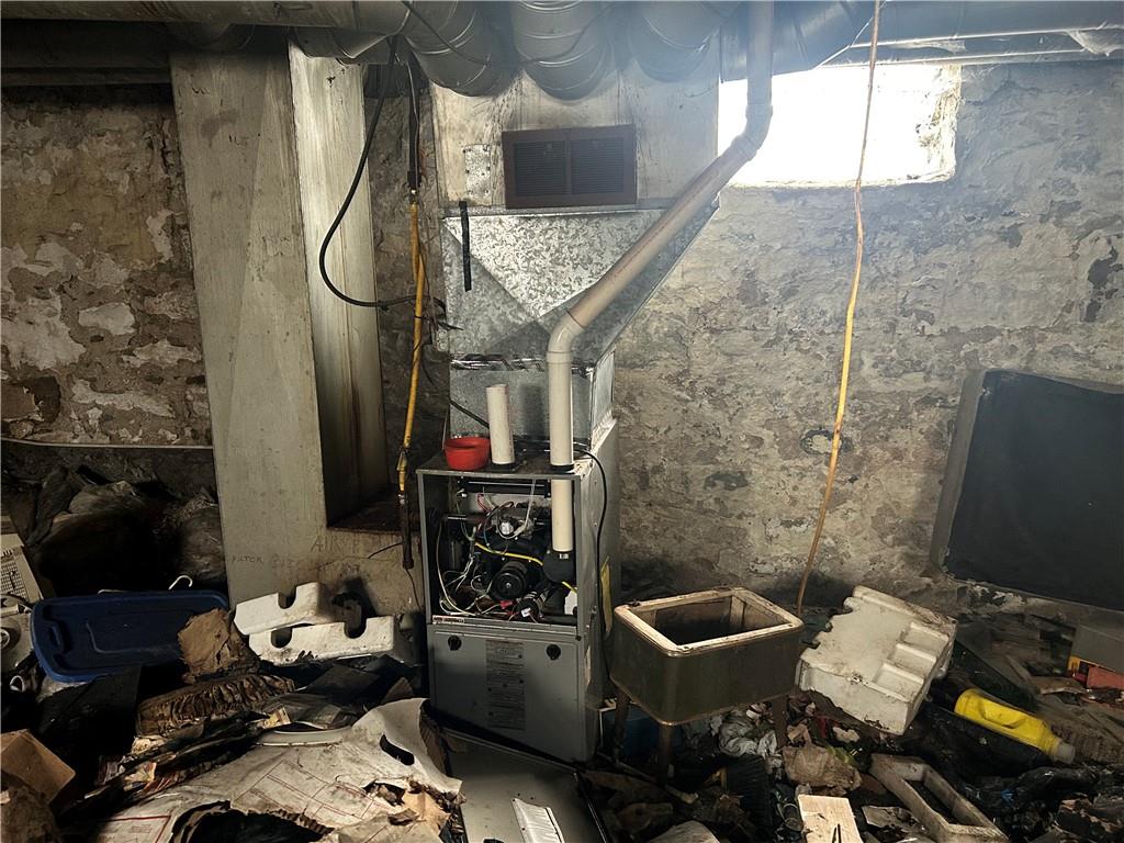 553 Price Avenue Braddock, PA 15104 - Photo 12 of 15 a bathroom with a sink and mirror