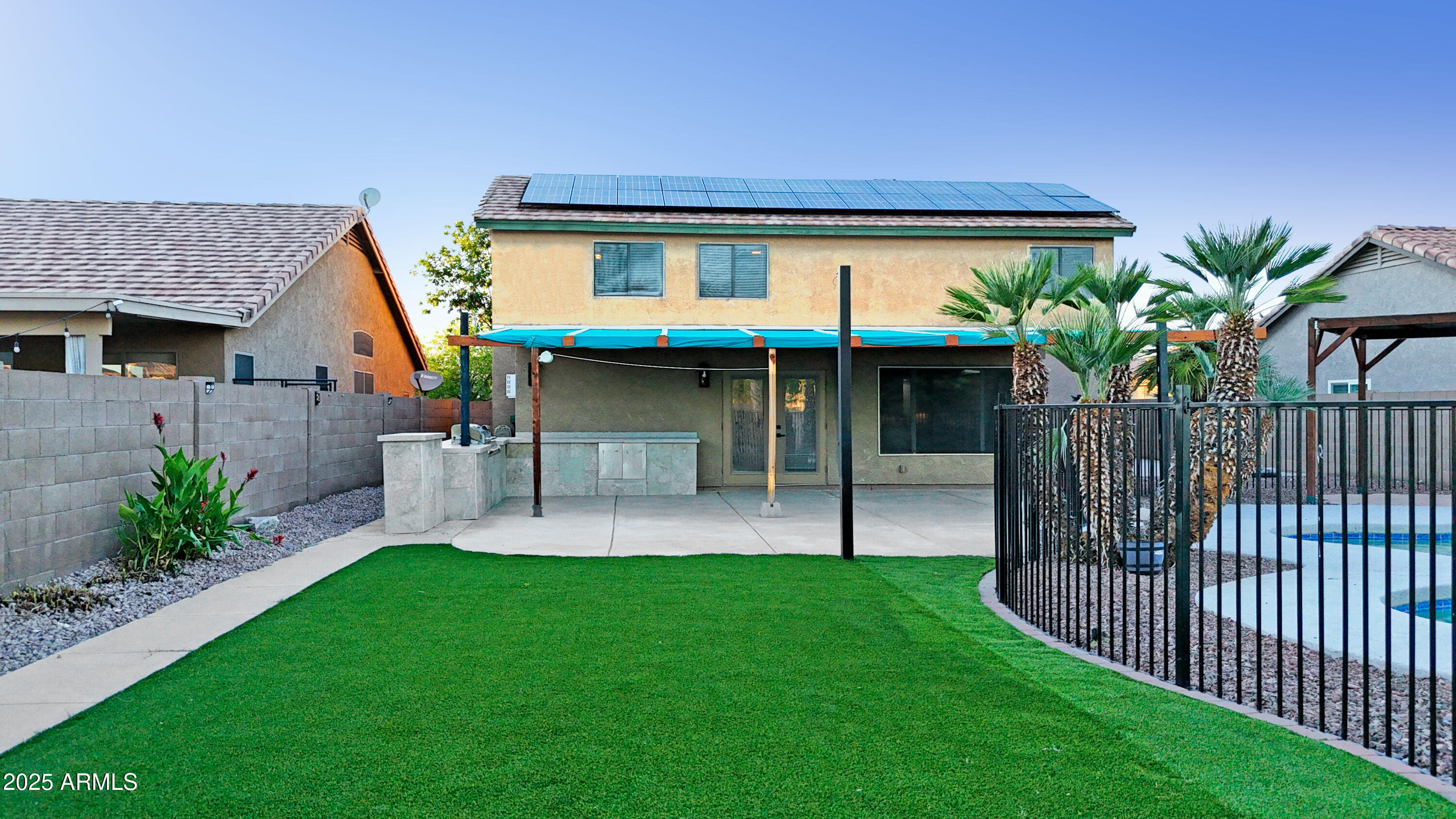 15727 West Rimrock Street Surprise, AZ 85374 - Photo 22 of 29 a view of a house with a porch and a yard