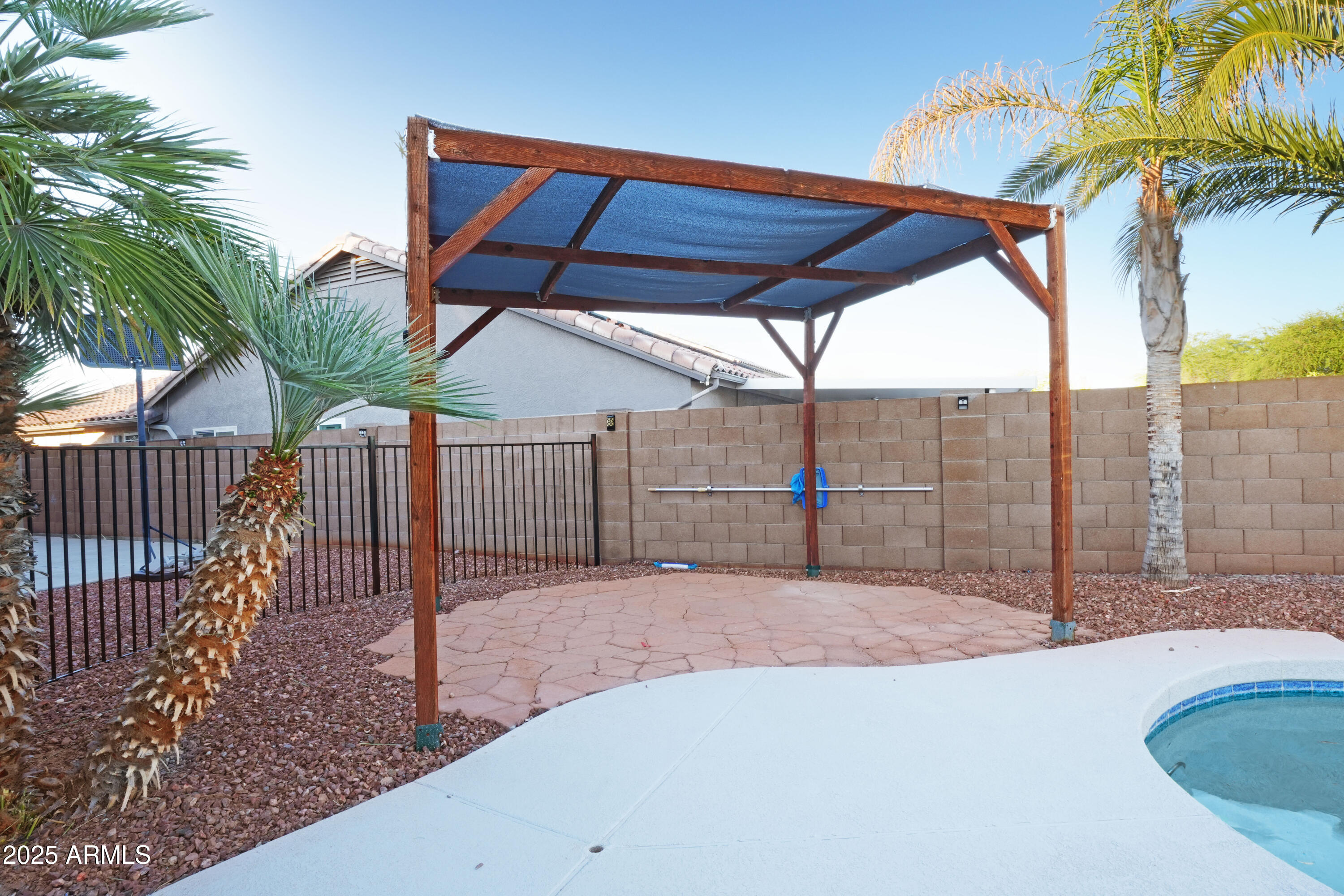 15727 West Rimrock Street Surprise, AZ 85374 - Photo 23 of 29 a view of backyard with a slide and potted plants