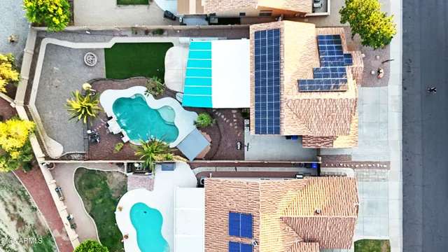 a picture of living room with furniture and a lamp