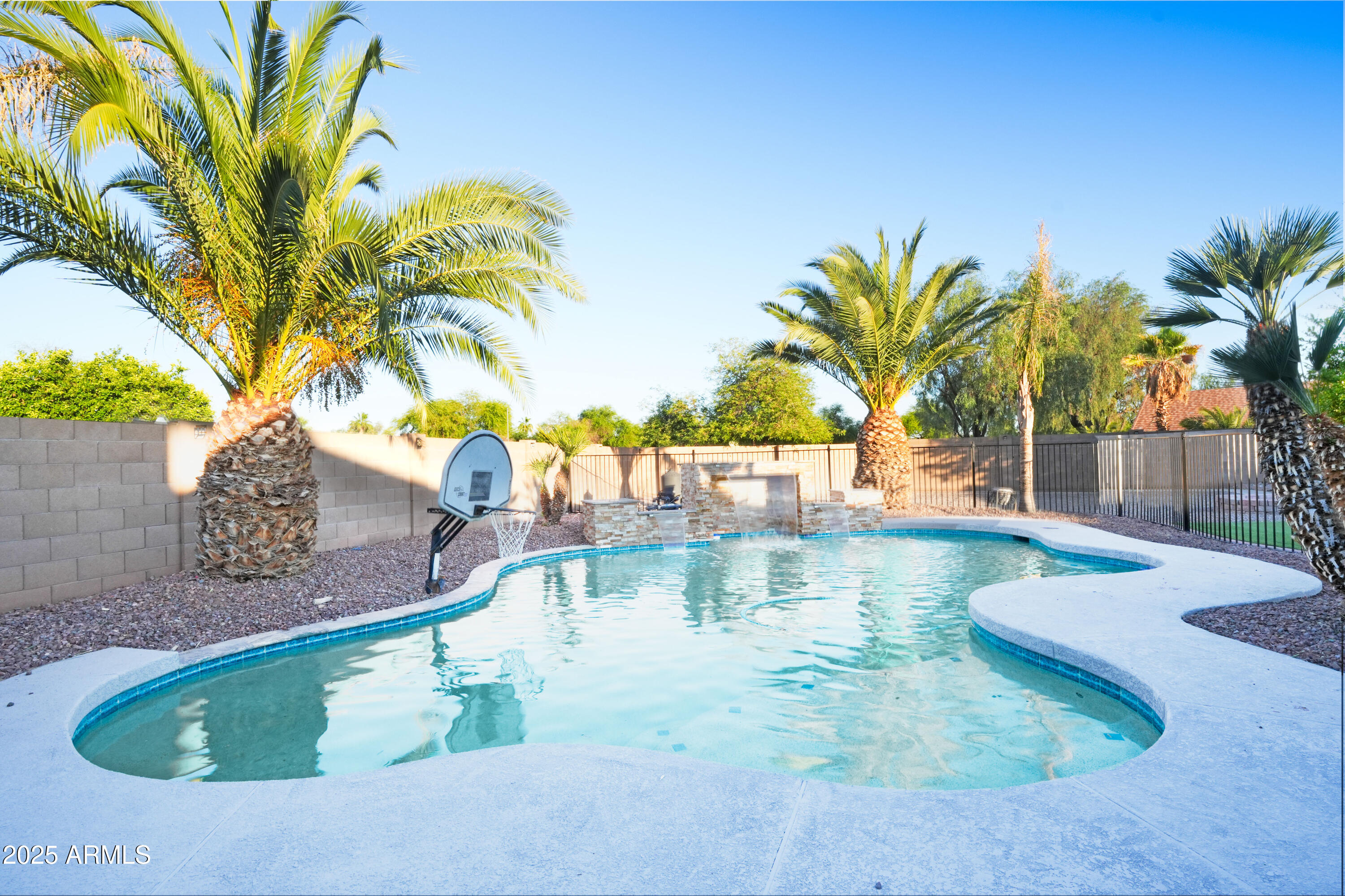 15727 West Rimrock Street Surprise, AZ 85374 - Photo 27 of 29 a view of a swimming pool with a patio