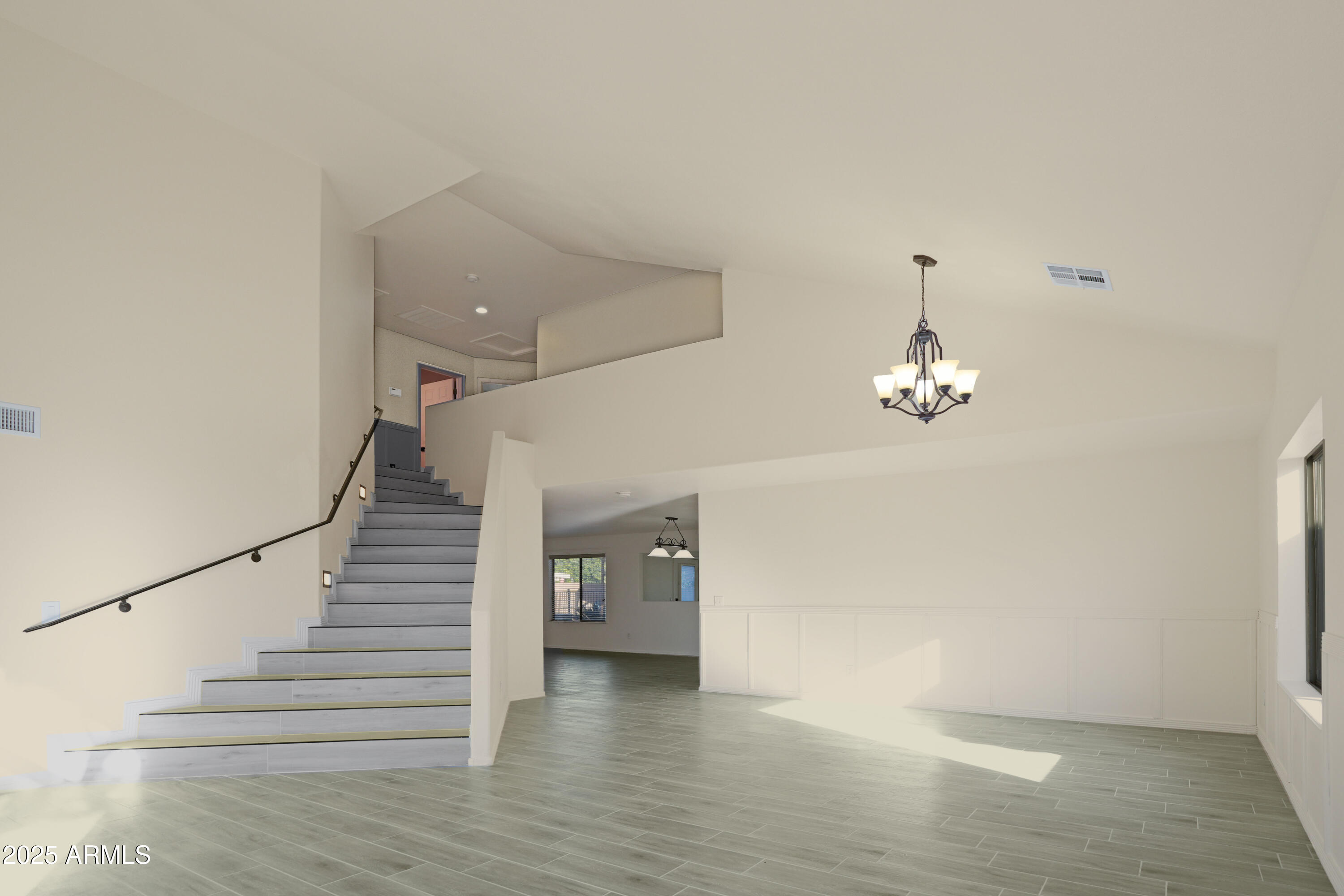 15727 West Rimrock Street Surprise, AZ 85374 - Photo 3 of 29 a view of an empty room with wooden floor