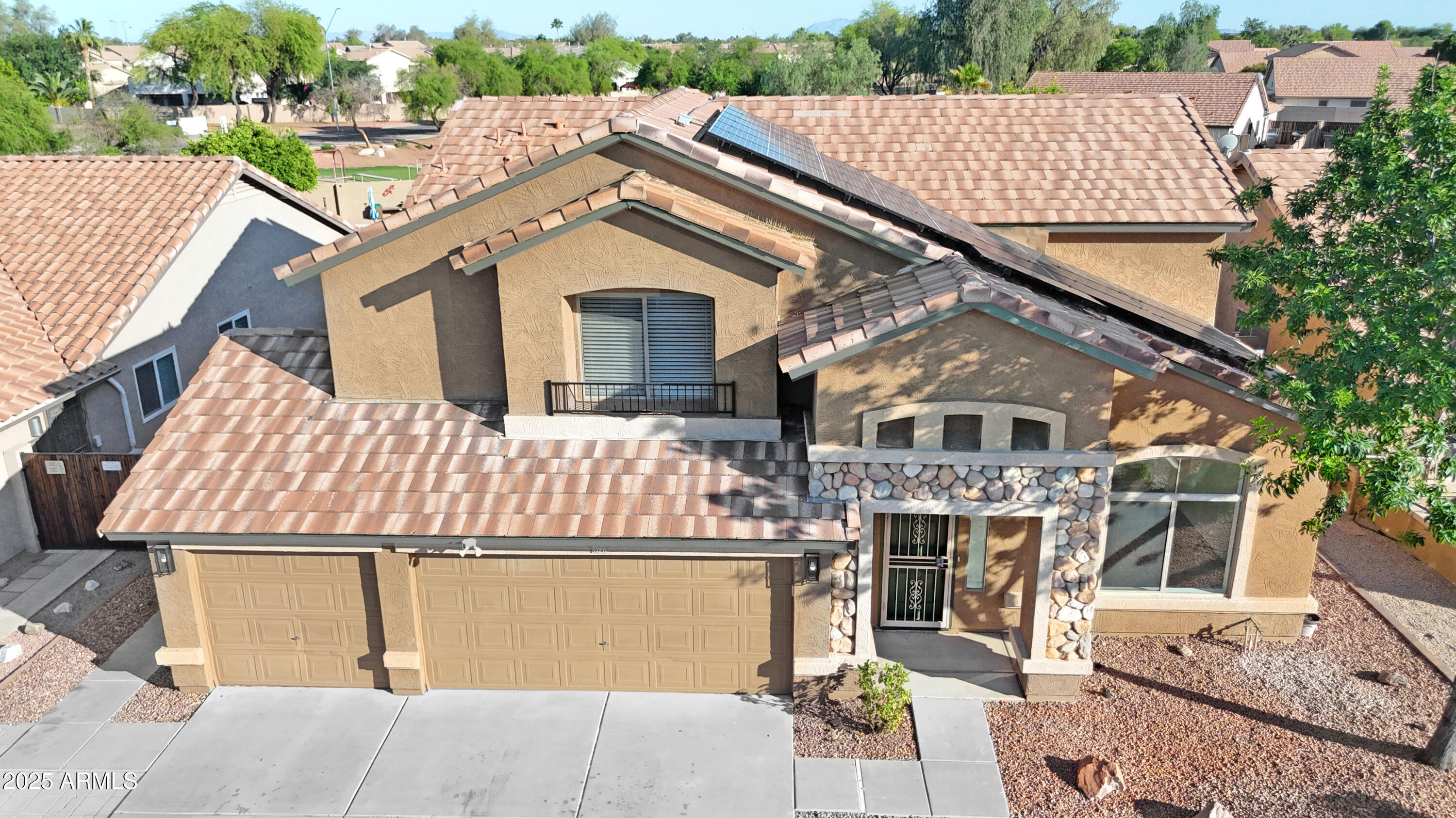 15727 West Rimrock Street Surprise, AZ 85374 - Photo 5 of 29 a aerial view of a house with a garage
