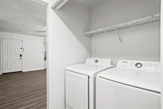 a view of storage and utility room with washer and dryer