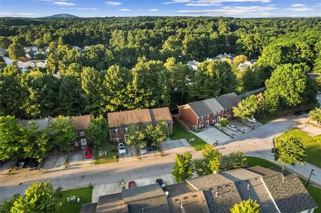an aerial view of a house with garden space and street view