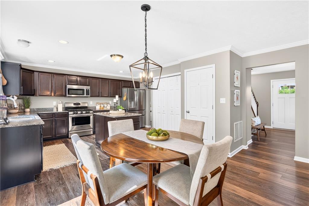 259 Foxwood Road Coraopolis, PA 15108 - Photo 12 of 49 The cozy breakfast area offers a welcoming spot to start the day, featuring natural light and a comfortable setting for meals.