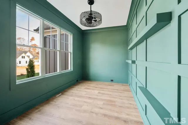 a bedroom with window and stairs