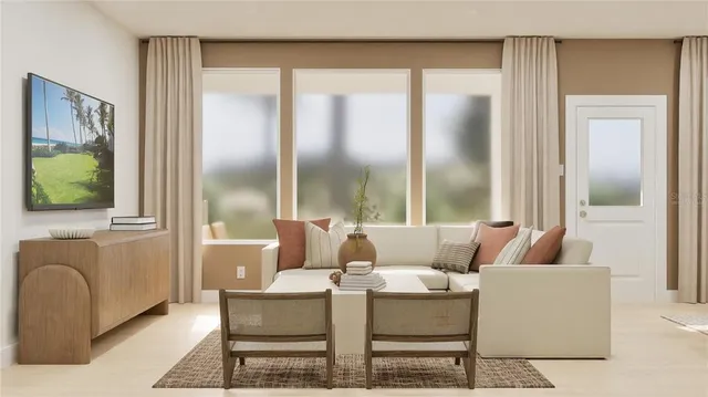 a living room with furniture and a large window