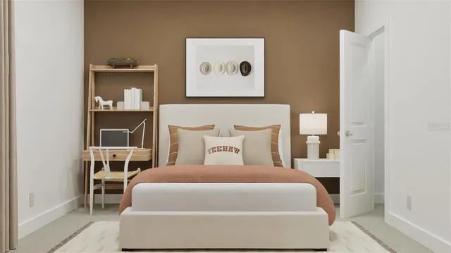 a bed sitting in a bedroom next to a window