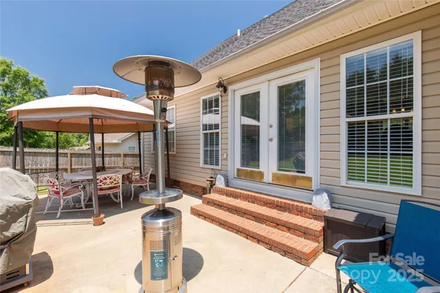 a backyard of a house with seating space