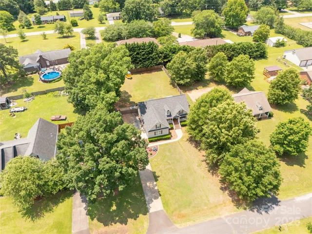 an aerial view of residential houses with swimming pool