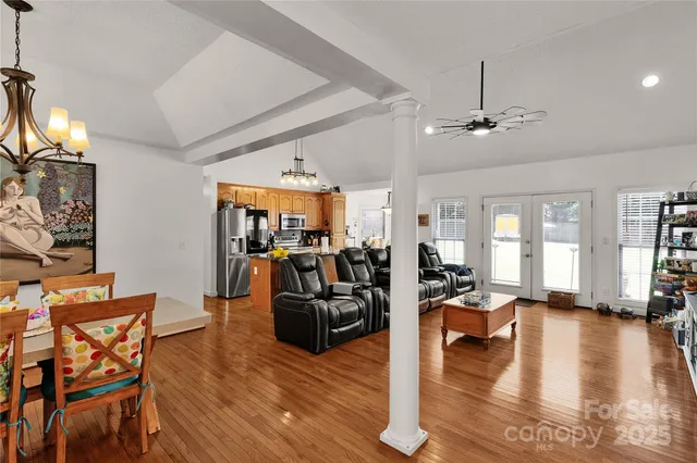a living room with fireplace furniture and a wooden floor