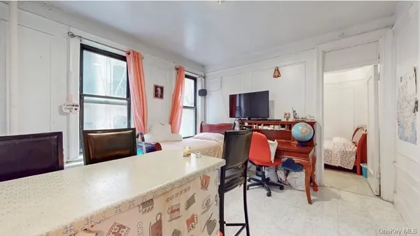 a living room with kitchen island furniture and a fireplace