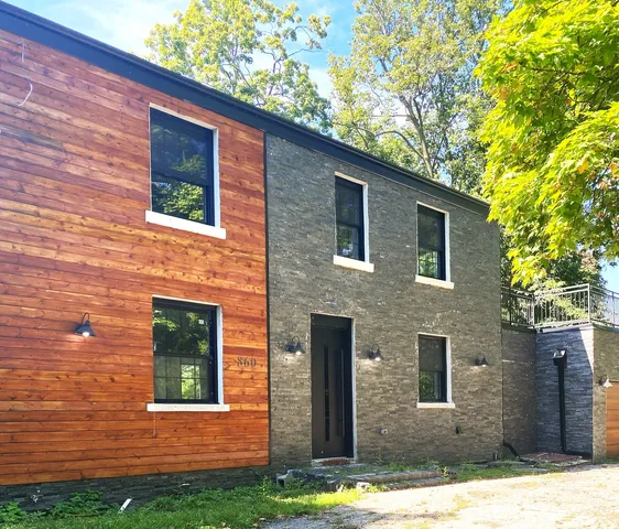 a front view of a house with yard