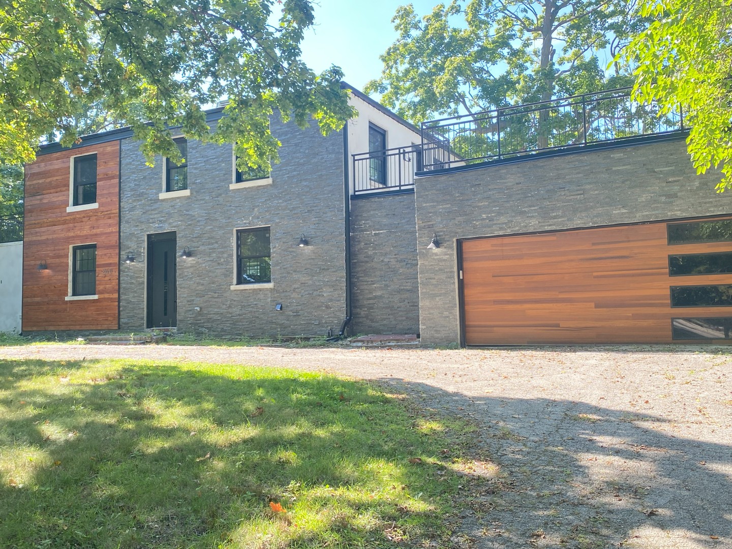860 Green Bay Road Highland Park, IL 60035 - Photo 2 of 30 a front view of a house with a yard and garage