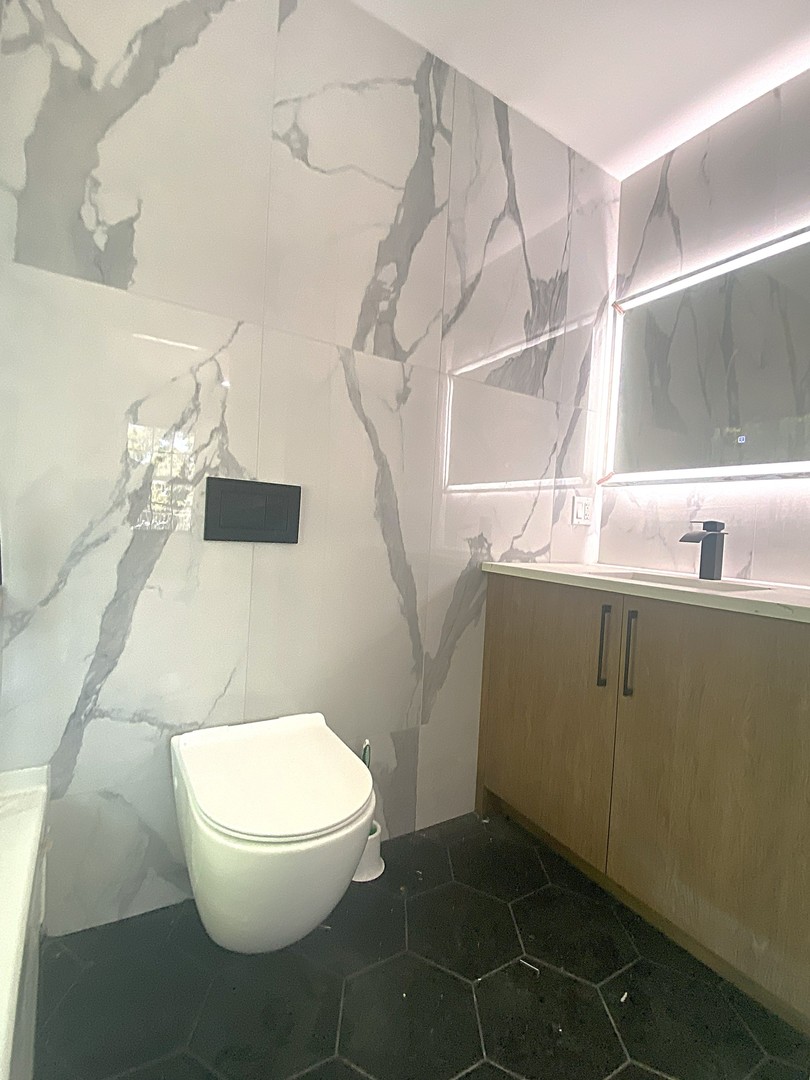 860 Green Bay Road Highland Park, IL 60035 - Photo 21 of 30 a bathroom with a toilet and a sink